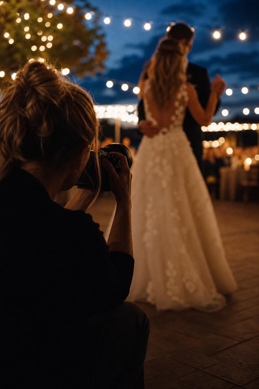Wedding photographer and florist preparing a reception